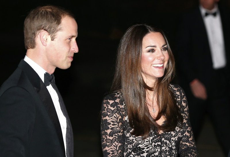Britain's Prince William, the Duke of Cambridge, left and Kate, the Duchess of Cambridge, arrive at the Natural History Museum in London to attend the screening of David Attenborough's Alive 3D film on Wednesday, Dec. 11, 2013. 