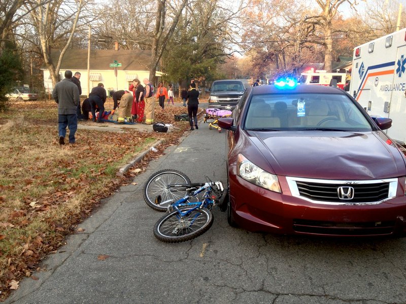 A Honda Accord and a bicycle that collided Thursday, Dec. 19, 2013, near West 25th and Abigail streets in Little Rock are seen afterward.