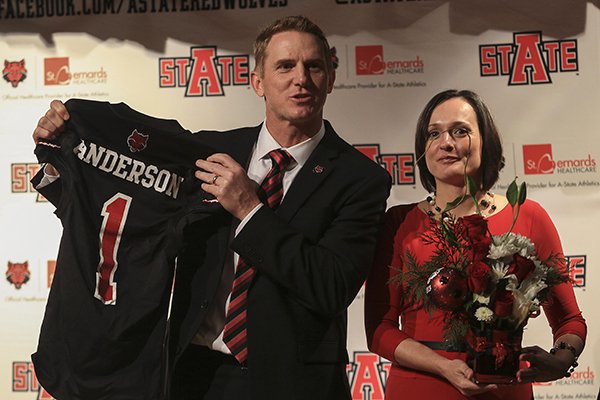 FILE — Arkansas State football coach Blake Anderson along with wife Wendy displays an ASU football jersey at a press conference in Jonesboro in this 2013 file photo.