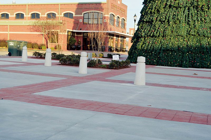 These concrete posts, called bollards, were installed in Rogers Plaza in downtown Conway. The bollards outline a driveway that gives access to businesses in a building owned by Dennis Fulmer, said Jack Bell, chief of staff to Mayor Tab Townsell.