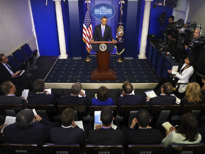 President Barack Obama speaks during his end-of-the-year news conference in the Brady Press Room at the White House in Washington, Friday, Dec. 20, 2013. Obama is scheduled to depart later for his home state of Hawaii for his annual Christmas vacation trip. (AP Photo/Charles Dharapak)