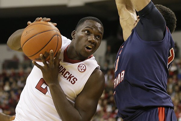 Arkansas' Alandise Harris, left, tries to get around South Alabama's Augustine Rubit the first half of an NCAA college basketball game in North Little Rock, Ark., Saturday, Dec. 21, 2013. (AP Photo/Danny Johnston)