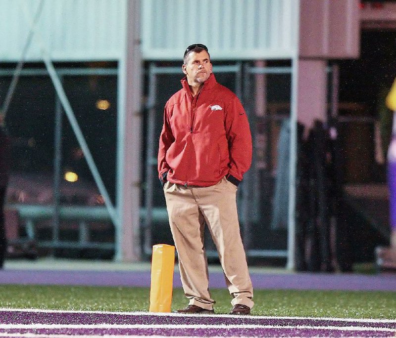 El Dorado News-Times/Michael Orrell

Arkansas Razorback assistant coach Charlie Partridge scouts players during the El Dorado vs. Pine Bluff game at Memorial Stadium in El Dorado on Friday. 