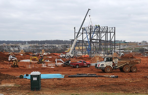 Construction crews work on the Arkansas Music Pavilion amphitheater Thursday, Dec. 19, 2013, near Pinnacle Hills Promenade in Rogers. The permanent home for the AMP is scheduled to open in the summer.