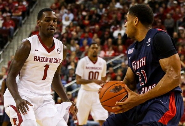 Arkansas guard Mardracus Wade defends South Alabama's Augustine Rubit Saturday Dec. 21, 2013, at Verizon Arena.