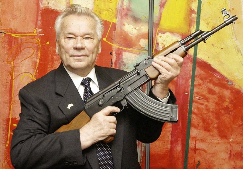 In this July 26, 2002, file photo, Russian weapon designer Mikhail Kalashnikov presents his legendary assault rifle to the media at a weapons museum in Suhl, Germany. 