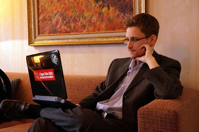 Edward Snowden, the former National Security Agency contractor who revealed information about NSA surveillance programs, is seen in a hotel room in Moscow in December, 2013. Snowden gave his first in-person interviews since arriving in Russia in June. Illustrates SNOWDEN (category i), by Barton Gellman (c) 2013, The Washington Post. Moved Monday, Dec. 23, 2013. (MUST CREDIT: Photo for The Washington Post by Barton Gellman)
