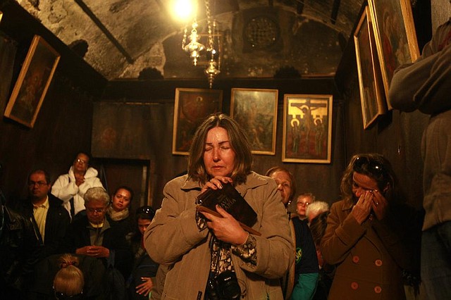 Worshippers visit the Grotto of the Church of Nativity, traditionally believed by Christians to be the birthplace of Jesus Christ, in the West Bank town of Bethlehem on Christmas Eve. 