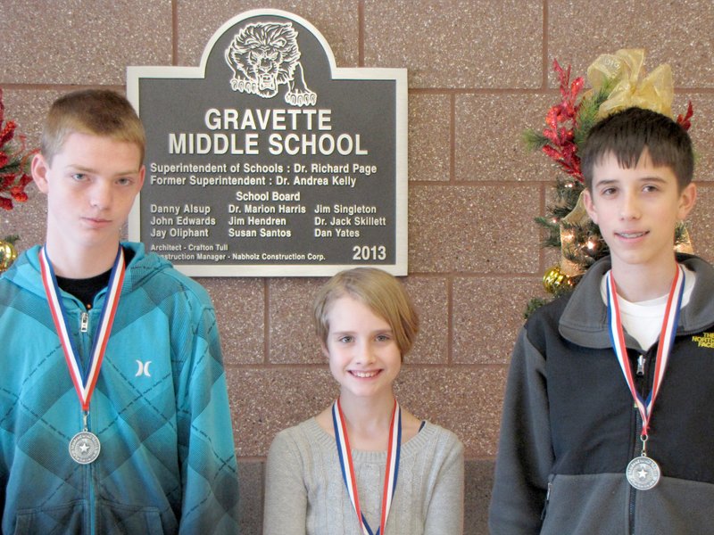 Submitted Photo December Students of the Month at Gravette Middle School are: Seventh Grade - Christian Tate; Sixth Grade - Claire Perry; and Eighth Grade - Chris Childress.