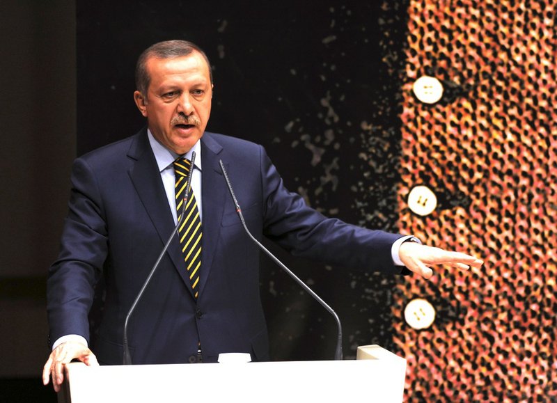 Turkey's Prime Minister Recep Tayyip Erdogan addresses his party members in Ankara, Turkey, on Wednesday, Dec. 25, 2013. 