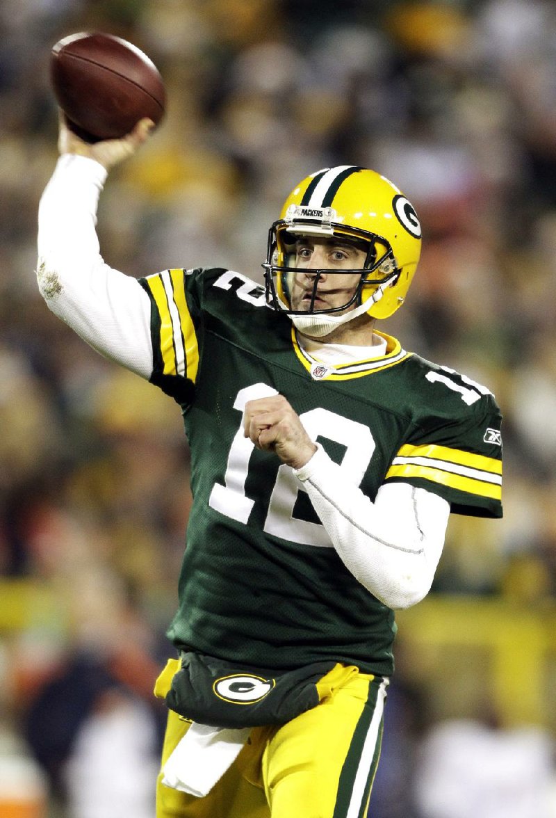 Green Bay Packers' Aaron Rodgers throws during the second half of an NFL football game against the Chicago Bears Sunday, Dec. 25, 2011, in Green Bay, Wis. (AP Photo/Morry Gash)
