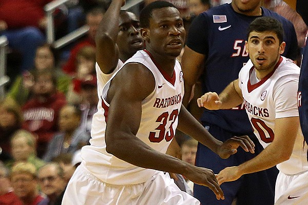 Arkansas' Moses Kingsley runs to defend against South Alabama's Aakim Saintil as he receives the ball during their game at Verizon Arena December 21, 2013. 