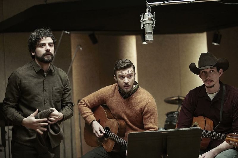 Oscar Isaac (from left), Justin Timberlake and Adam Driver work on a tune in the Coen Brothers’ Inside Llewyn Davis. Is this the Coens’ best film yet? 