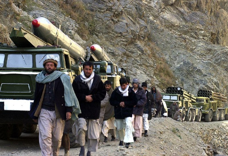 A convoy of heavy weapons leaves the Panjshir Valley in December 2003. While most Afghan warlords gave up their heavier armaments under U.S. pressure, Afghan security experts say the Panjshir militias stashed many weapons in the mountains. “We have plenty of weapons, believe me,” one former militiaman said recently. 