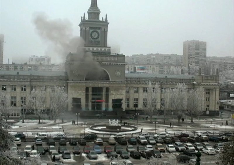 In this photo made by a public camera and made available by the Associated Press Television News smoke pours out after an explosion at Volgograd railway station, in Volograd Russia on Sunday, Dec. 29, 2013. More then a dozen people were killed and scores were wounded Sunday by a suicide bomber at a railway station in southern Russia, officials said, heightening concern about terrorism ahead of February's Olympics in the Black Sea resort of Sochi. (AP Photo/ Associated Press Television News)