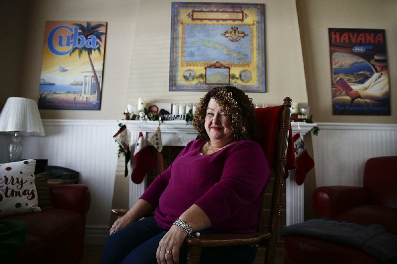 Cuban food blogger Marta Darby poses for photos in her home on Tuesday, Dec. 17, 2013, in Mission Viejo, Calif. Darby will be making a toast to Cuba this year, accompanied with a glass of the rum-based eggnog known as the "creme de vie" or "cream of life." (AP Photo/Jae C. Hong)