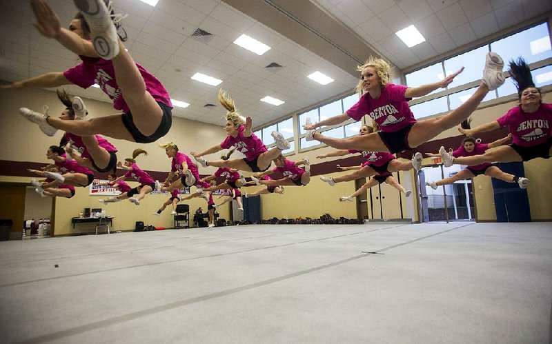 Arkansas Democrat-Gazette/MELISSA SUE GERRITS 11/21/13 - Benton Cheerleaders practice competition routines as well as game routines at Benton High School November 21, 2013. The girls' cheer practice takes place for 3 hours with warm ups and then practicing the steps and timing of various routines. 