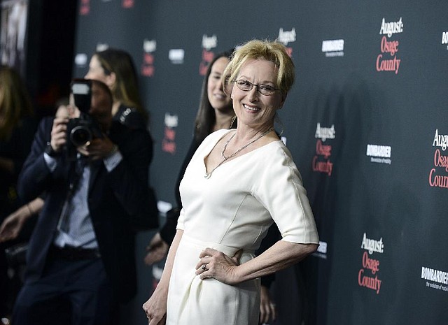 Actress Meryl Streep arrives at the premiere of the feature film "August: Osage County" at Regal Cinemas L.A. Live on Monday, Dec. 16, 2013 in Los Angeles. (Photo by Dan Steinberg/Invision/AP)