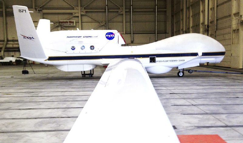 FILE - This Sept.  2013 file photo shows The Reaper drone, now known as a Global Hawk, at Edwards Air Force Base in California. The Federal Aviation Administration announced six states on Monday Dec. 30, 2013, that will develop test sites for drones, a critical next step for the march of the unmanned aircraft into U.S. skies. Alaska, Nevada, New York, North Dakota, Texas and Virginia will host the research sites, the agency said. (AP Photo/ Las Vegas Sun, Richard Velotta, File) LAS VEGAS REVIEW JOURNAL OUT