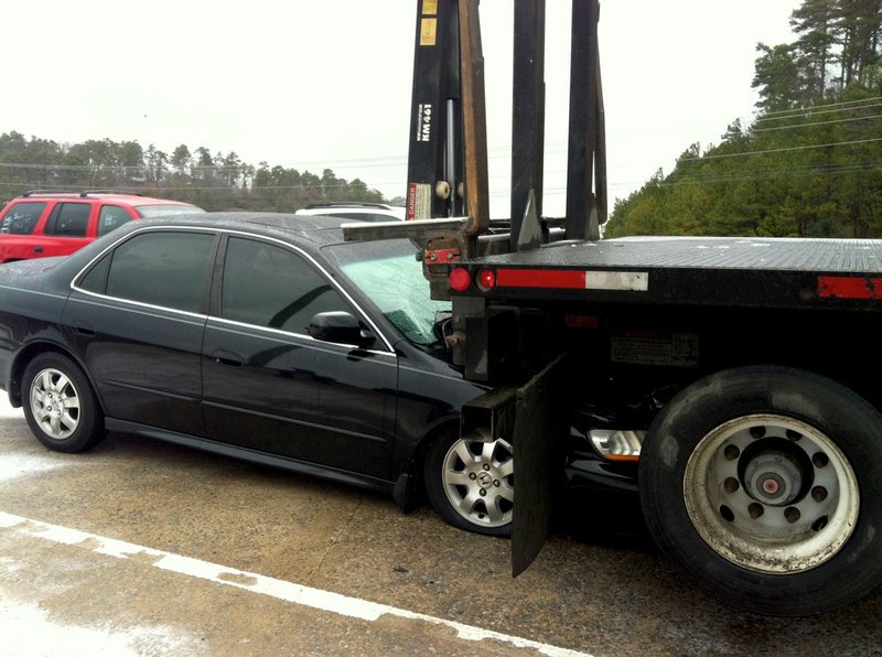 A wreck shortly before 11 a.m. Monday, Dec. 30, 2013, slows traffic on Cantrell Road near the Interstate 430 North exit in Little Rock. 
