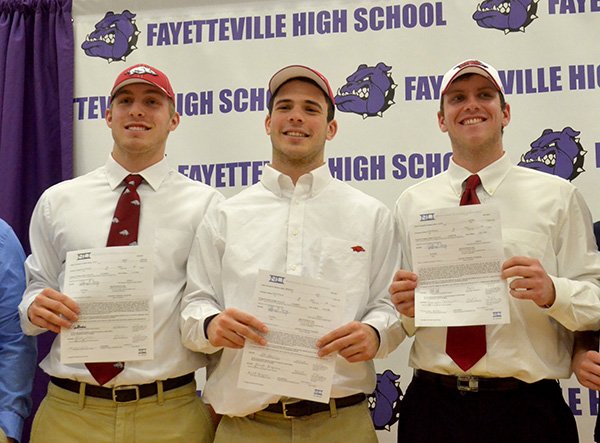 Fayetteville High students (left to right) Brooks Ellis, Alex Brignoni and Austin Allen signed letters of intent to play football at the University of Arkansas.