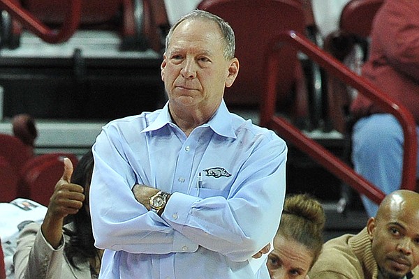 University of Arkansas coach Tom Collen watches from the sidelines during the first half of a Dec. 10, 2013 game against the Tulsa Golden Hurricane at Bud Walton Arena in Fayetteville.