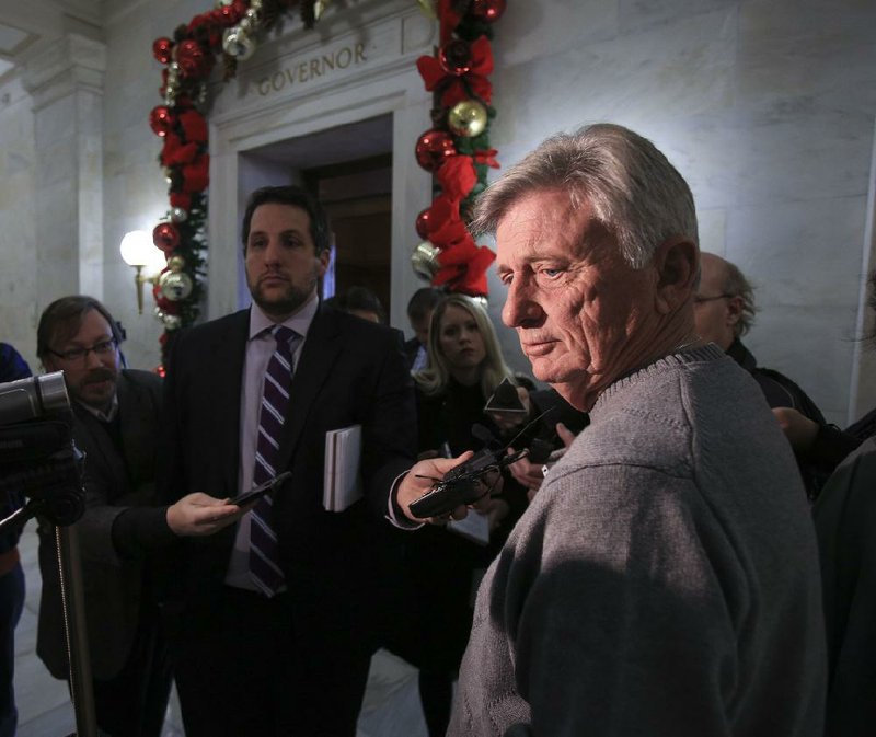 Gov. Mike Beebe takes questions Tuesday outside his office at the state Capitol. Beebe said he made a “short and sweet” call to Lt. Gov. Mark Darr asking him to resign but was refused. “That’s disappointing,” Beebe said he told Darr. 