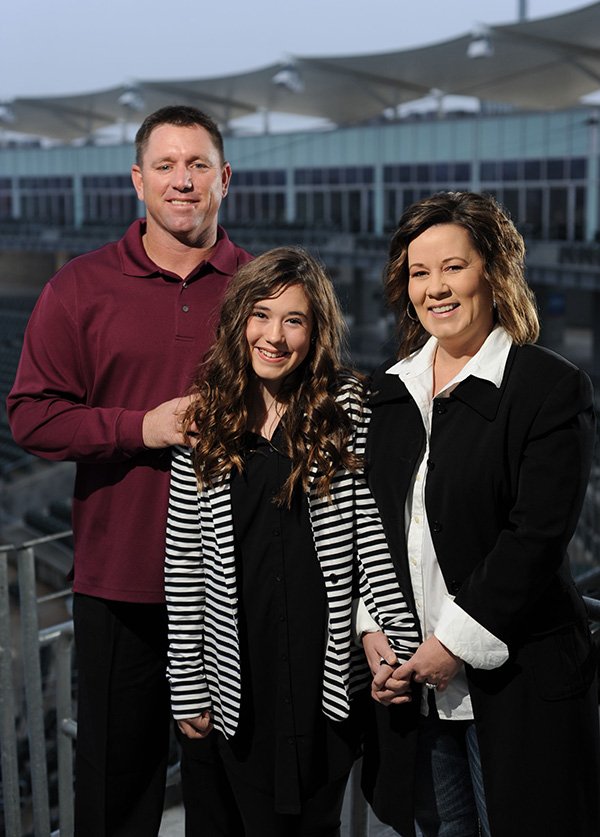 STAFF PHOTO ANDY SHUPE 
Vance Wilson, seen here Dec. 20, with his wife, Bridget and 13-year-old daughter, Peyton, has been named the manager of the Northwest Arkansas Naturals.