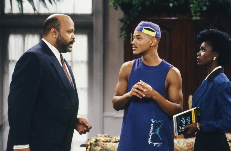 This photo provided by NBC shows, from left, James Avery as Philip Banks, Will Smith as William "Will" Smith, and Janet Hubert as Vivian Banks, in episode 7, "Def Poet's Society" from the TV series, "The Fresh Prince of Bel-Air." Avery, 65, the bulky character actor who laid down the law as the Honorable Philip Banks has died. Avery's publicist, Cynthia Snyder, told The Associated Press that Avery died Tuesday.