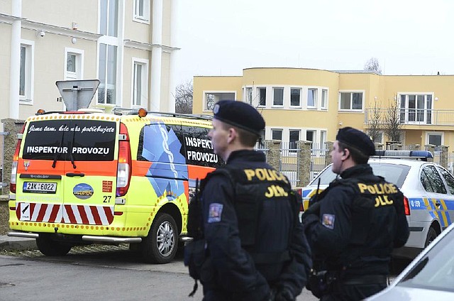 Police officers observe the situation near the residence of Palestinian ambassador to the Czech Republic Jamal Al Jamal, who was killed in an explosion Wednesday in a diplomatic flat in Prague-Suchdol. 