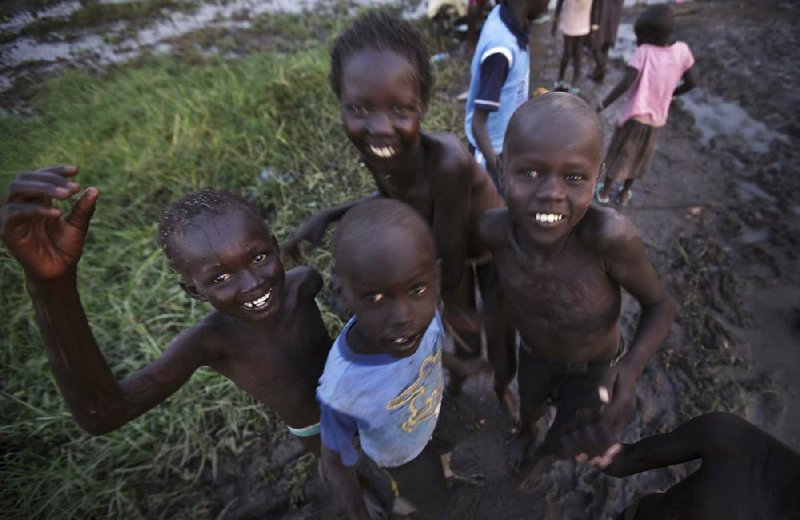 Sudanese children displaced by fighting in Sudan play and bathe in the Nile River near Awerial, South Sudan, on Wednesday. 