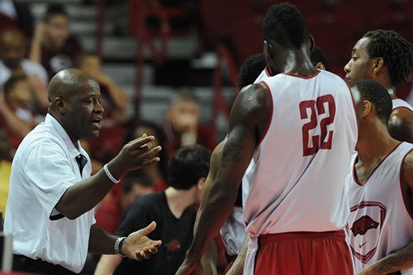Arkansas coach Mike Anderson speaks to members of the white squad during the first half of play in the Red-White game Sunday, Oct. 27, 2013, in Bud Walton Arena in Fayetteville.