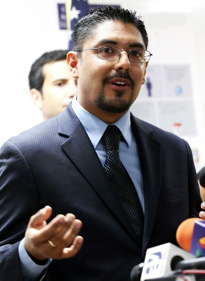 File - In this Aug. 27, 2013 file photo, Sergio Garcia speaks at The Coalition for Humane Immigrant Rights of Los Angeles news conference in Los Angeles. The California Supreme Court granted a law license on Thursday, Jan. 2, 2014, to Garcia, who is living in the United States illegally. Garcia, who graduated from law school and passed the state bar exam, can begin practicing law despite his immigration status. He arrived in the U.S. illegally 20 years ago to pick almonds with his father. (AP Photo/Nick Ut, File)