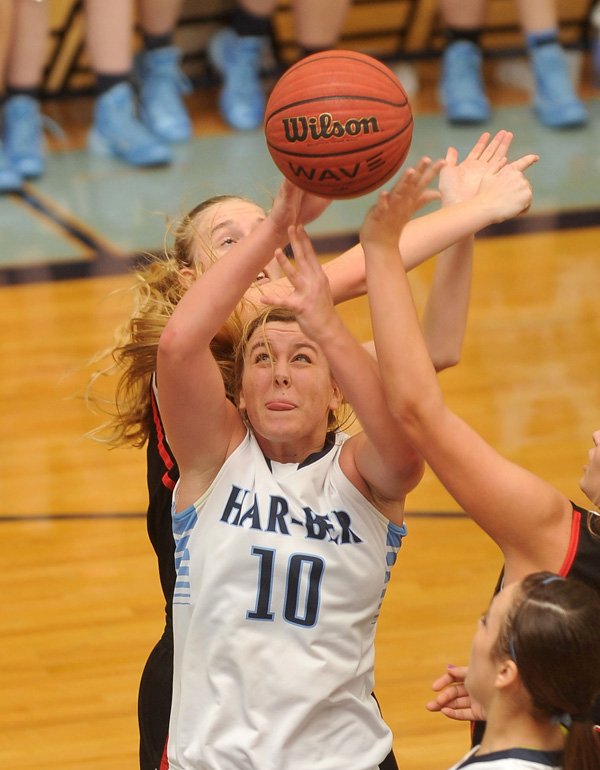 Har-Ber High school's Bailey Schalk and Pea Ridge defender Mikheala Cochran fight for a rebound during Tuesday nights game at Har-Ber High School in Springdale.