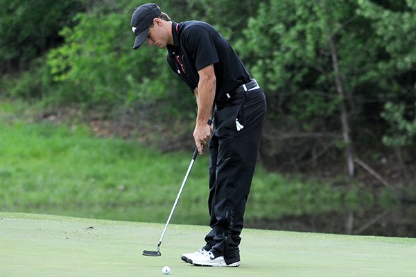 Arkansas golfer Taylor Moore putts on the fifth green during the opening round of the NCAA Regional Golf Tournament Thursday, May 16, 2013 at the Blessing Golf Club in Fayetteville.