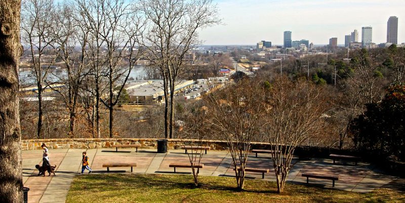 Arkansas Democrat-Gazette/MICHAEL STOREY

Young dog walkers enjoy the trail at Little Rock's Knoop Park. The park, surrounding the Ozark Point Water Treatment Plant, features an outstanding vista of downtown and the Arkansas River.
