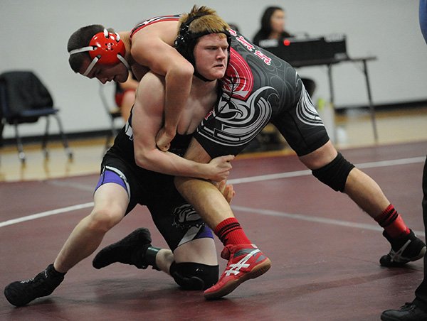 STAFF PHOTOS ANDY SHUPE 
Dane Shields of Fayetteville, left, wrestles Searcy’s Christian Stepanovich during the Diamond State Duals at Sprindale Har-Ber High School.
