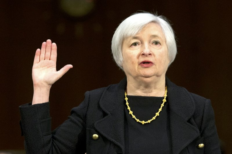 In this Thursday, Nov. 14, 2013, file photo, Janet Yellen of California, President Barack Obama's nominee to become Federal Reserve Board chairman, is sworn in on Capitol Hill in Washington prior to testifying before the Senate Committee hearing on her nomination to succeed Ben Bernanke. 