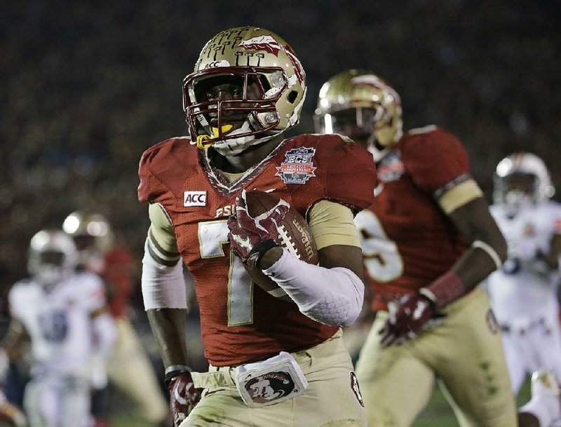 Florida State's Levonte Whitfield (7) runs back a kickoff for a touchdown during the second half of the NCAA BCS National Championship college football game against Auburn Monday, Jan. 6, 2014, in Pasadena, Calif. (AP Photo/David J. Phillip)