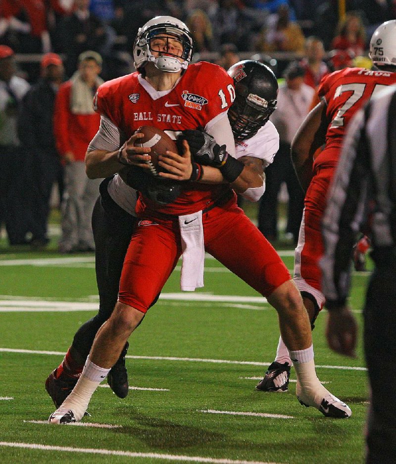 1/5/14
Arkansas Democrat-Gazette/STEPHEN B. THORNTON
Arkansas State University's Kyle Coleman sacks Ball State University's QB Keith Wenning
 on the ASU one yard line during the first half GoDaddy Bowl Sunday at Ladd-Peebles Stadium in Mobile, Ala. BSU was forced to punt.