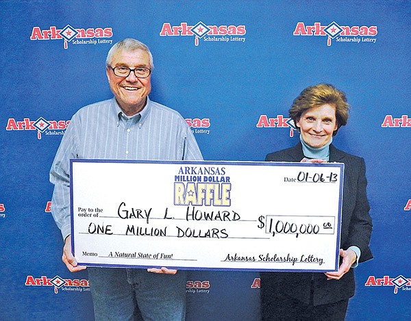 COURTESY PHOTO 
Gary Howard of Fayetteville is seen Monday with his wife, Nancy, after turning in the $1 million ticket in the Arkansas Scholarship Lottery’s Million Dollar Raffle. The winning lottery ticket was purchased at the Fast Trax convenience store on Bowen Boulevard in Goshen.