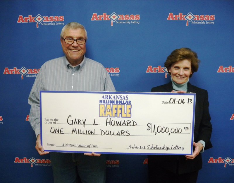Gary and Nancy Howard pose with a check for $1 million after claiming the winning ticket in the Million Dollar Raffle.