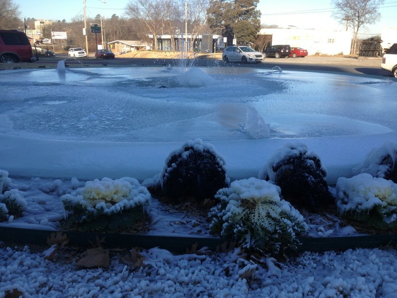 A fountain on the north end of the state Capitol grounds, near Markham and Third streets in Little Rock, freezes Tuesday, Jan. 7, 2014, amid below-average winter temperatures.