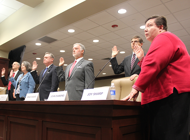 Panelists are sworn in Tuesday before a legislative meeting concerning the UA audit. From left to right: UA-Fayetteville Vice Chancellor for Finance and Administration Don Pederson, UA-Fayetteville Associate Vice Chancellor for Financial Affairs Jean Schook, UA-Fayetteville Chancellor David Gearhart, former UA-Fayetteville Vice Chancellor for Advancement Brad Choate, former UA-Fayetteville Associate Vice Chancellor for University Relations John Diamond and former UA-Fayetteville Advancement Division Budget Director Joy Sharp.