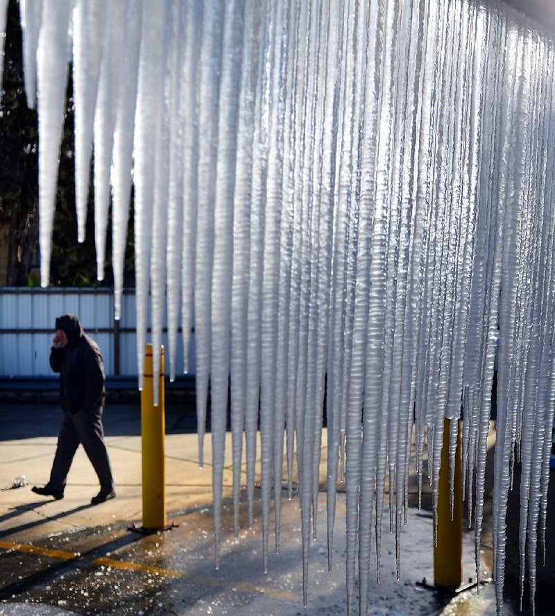 Icicles cover a carwash Tuesday on South Claiborne Avenue in New Orleans after unusually cold weather caused water pipes to burst. 