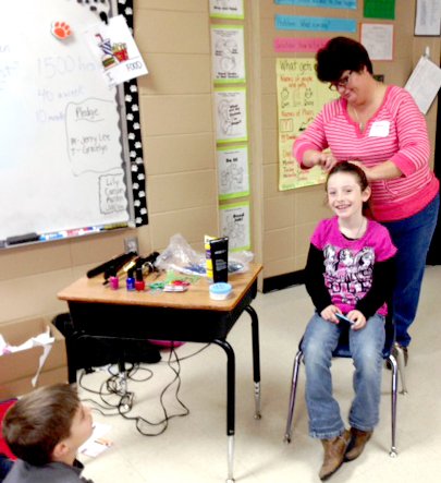 Submitted Photo Nedra Engleman chose this second grader to demonstrate how a beautician creates a hair style.