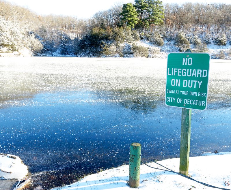 Photo by Randy Moll With temperatures just below zero on Monday morning, ice covered most of Crystal Lake in Decatur following freezing rain, sleet and snow on Sunday morning. Snow and ice also covered roadways, making travel treacherous.