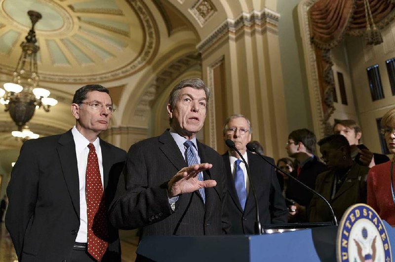 Sen. Roy Blunt (center), R-Mo., flanked by Senate Minority Leader Mitch McConnell (right), R-Ky., and Sen. John Barrasso, R-Wyo., meet with reporters after Tuesday’s procedural vote on legislation to renew jobless benefits for the long-term unemployed. 