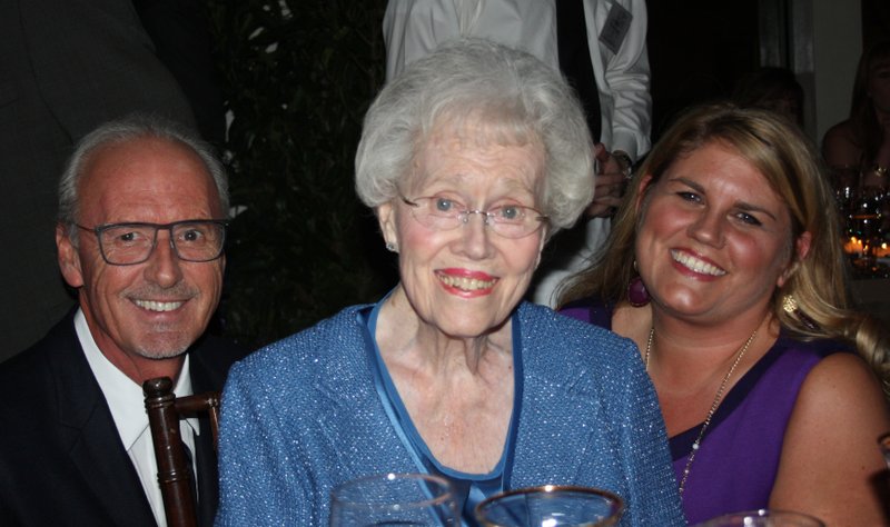 Pat Walker, center, is joined by her son Johnny Mike Walker and Mandy Macke of the Willard and Pat Walker Charitable Foundation at a recent charity benefit. 