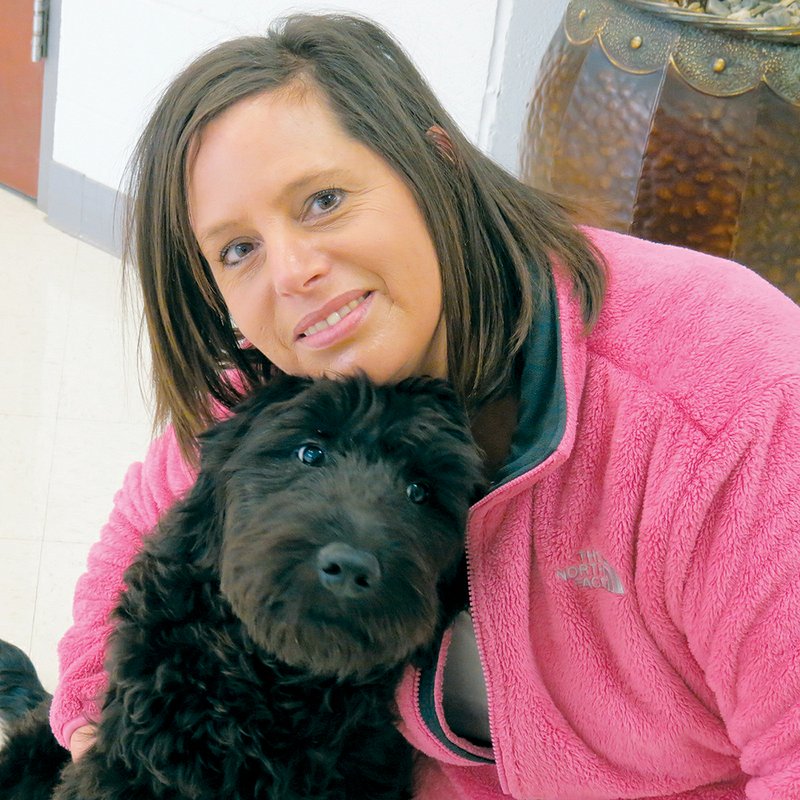 Vilonia Middle School administrative assistant Sarah Penter, who is the handler for therapy dog Bella, said the two are getting A’s on their report cards for learning their commands.